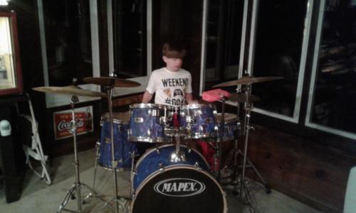 A SCARBARY BEHIND THE DRUMS